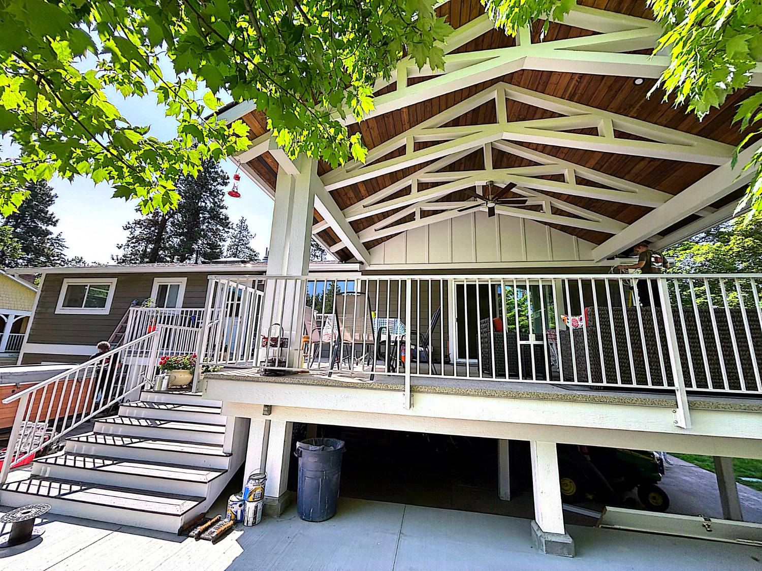 Covered deck with railings and stairs