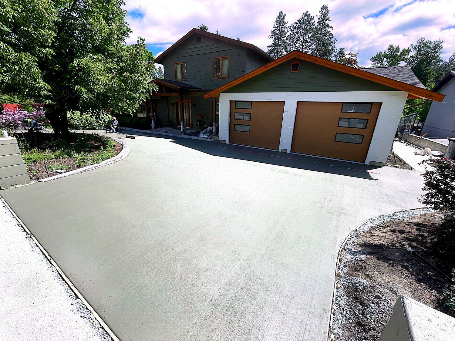 Garage addition with new concrete driveway